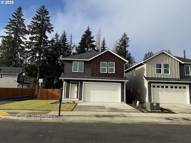 view of property with central AC, a front lawn, and a garage