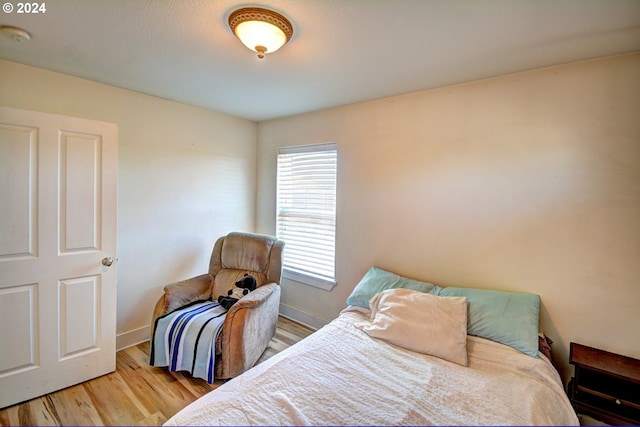 bedroom with light wood-type flooring