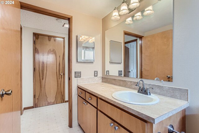 unfurnished room with light hardwood / wood-style floors and a textured ceiling