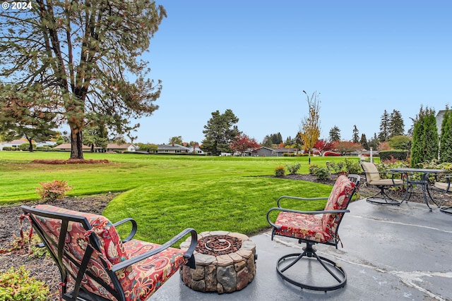 exterior space featuring a fire pit and a patio area