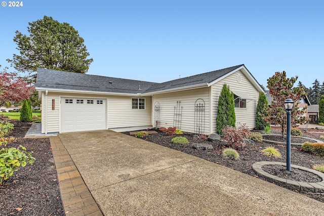 ranch-style home featuring a garage