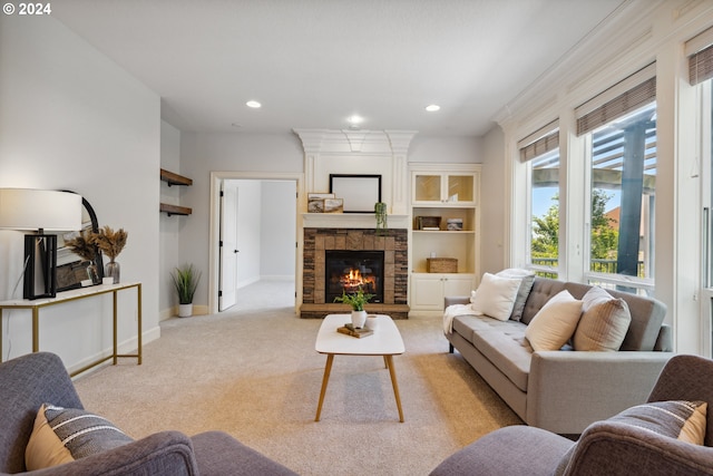 carpeted living room featuring built in shelves and a fireplace