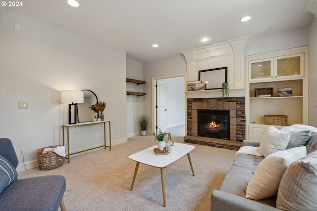 carpeted living room with a fireplace