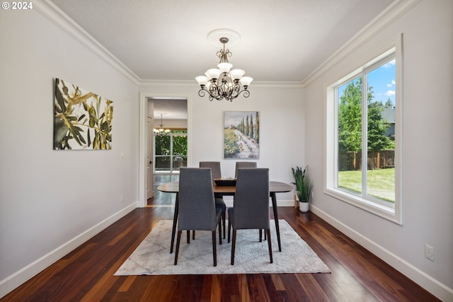 dining space with ornamental molding, dark hardwood / wood-style flooring, and a chandelier