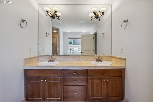 bathroom featuring vanity and a chandelier