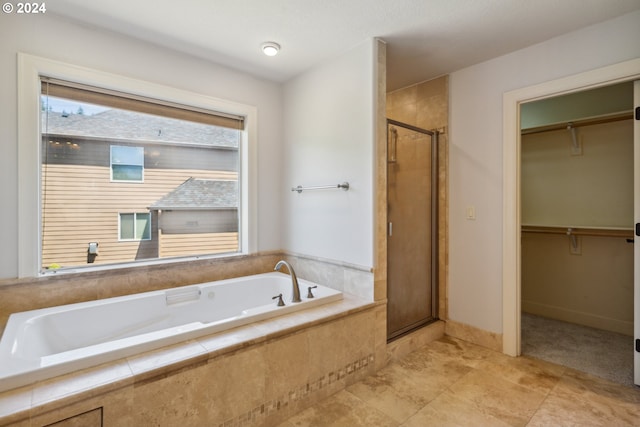 bathroom with shower with separate bathtub