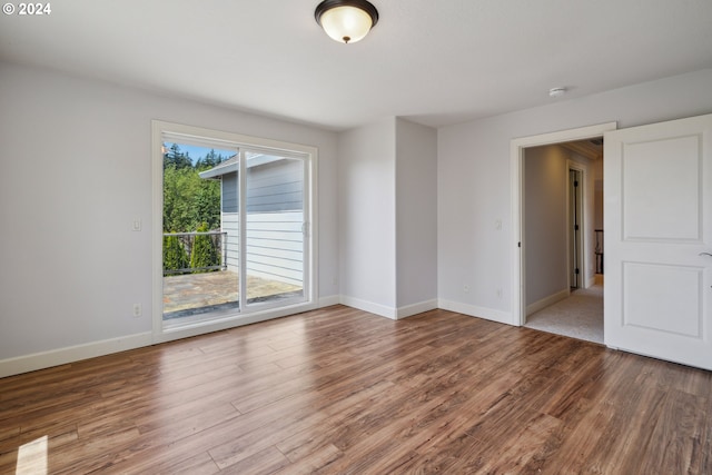 empty room featuring wood-type flooring