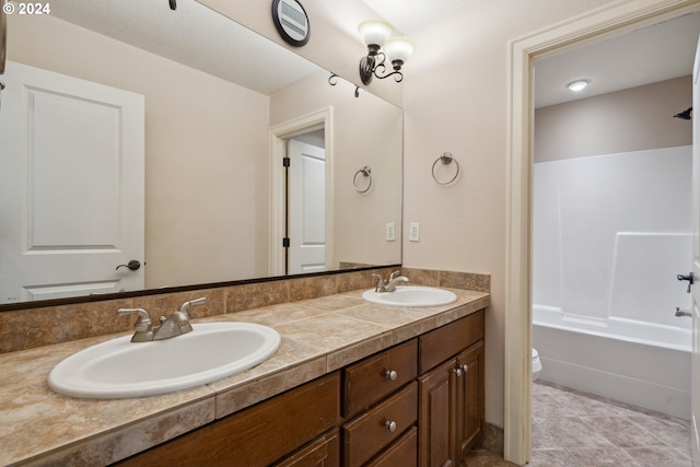 full bathroom with vanity, bathing tub / shower combination, and toilet