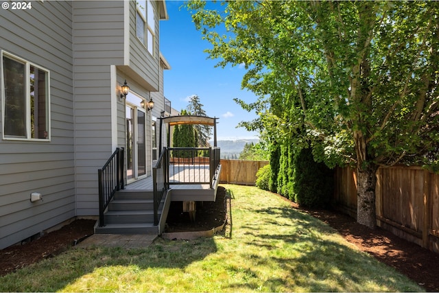 view of yard featuring a wooden deck