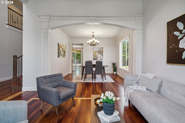 living room with dark wood-type flooring and ornamental molding