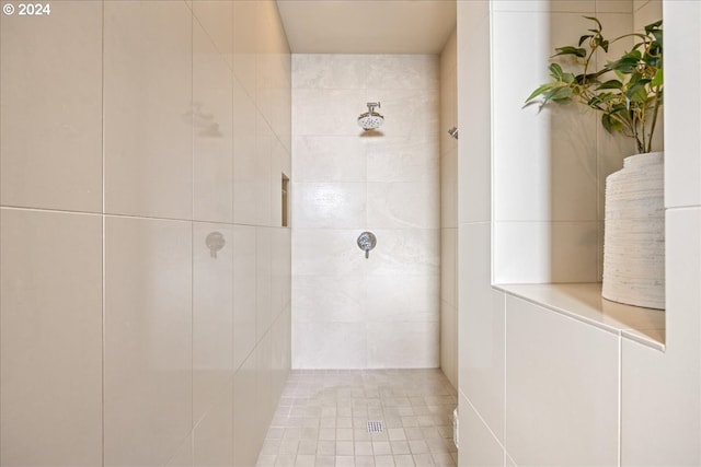 bathroom with a tile shower