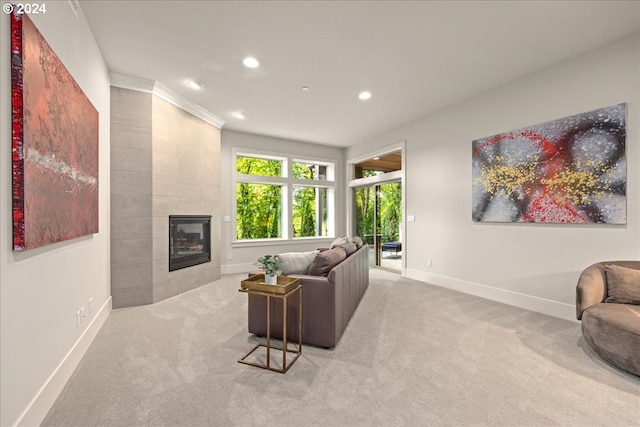 living room featuring light carpet and a tile fireplace