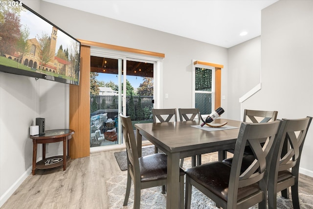 dining space with light hardwood / wood-style floors