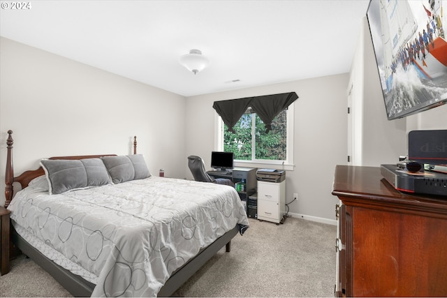 bedroom featuring light colored carpet