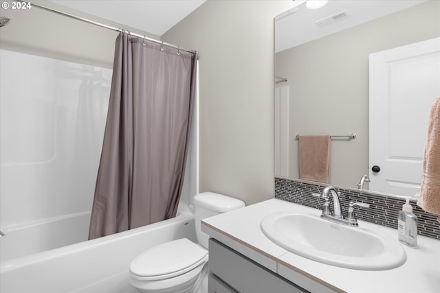 full bathroom featuring shower / bath combo, vanity, decorative backsplash, and toilet