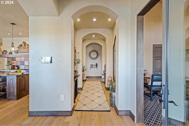 26590 SW French Oak Dr, West Linn, OR 97068 - hall with arched walkways, light wood-style flooring, and recessed lighting