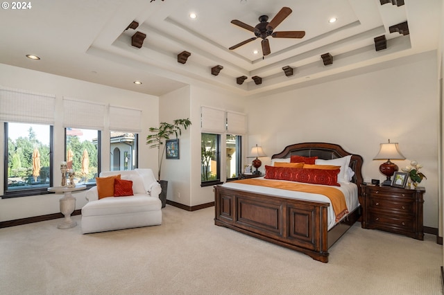 26590 SW French Oak Dr, West Linn, OR 97068 - bedroom featuring baseboards, recessed lighting, a ceiling fan, a tray ceiling, and light colored carpet