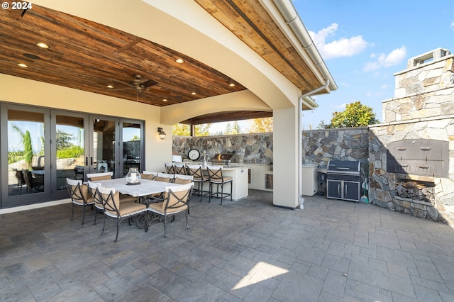 26590 SW French Oak Dr, West Linn, OR 97068 - view of patio with area for grilling, a fireplace, outdoor dining space, grilling area, and french doors