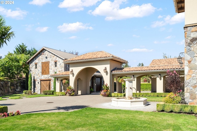 rear view of property with a lawn