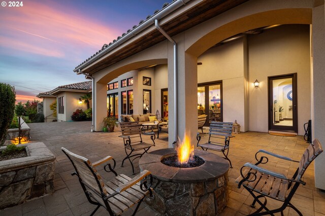 26590 SW French Oak Dr, West Linn, OR 97068 - patio terrace at dusk with an outdoor living space with a fire pit