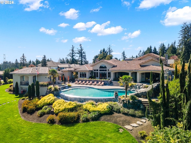 view of pool with a yard and a patio area