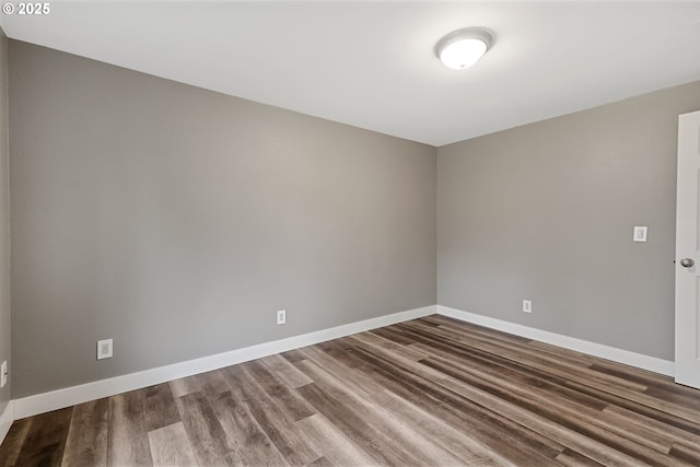 empty room featuring wood-type flooring