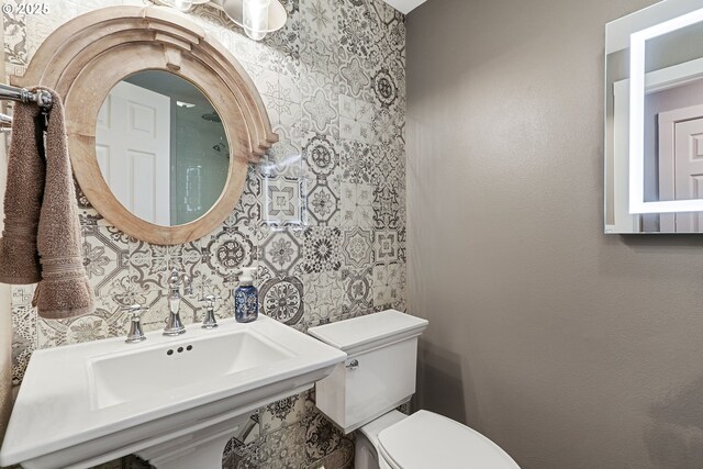 bathroom with sink and toilet