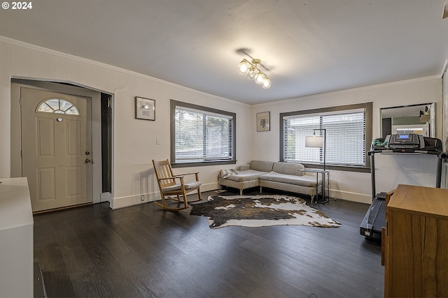 living room with ornamental molding and dark hardwood / wood-style flooring