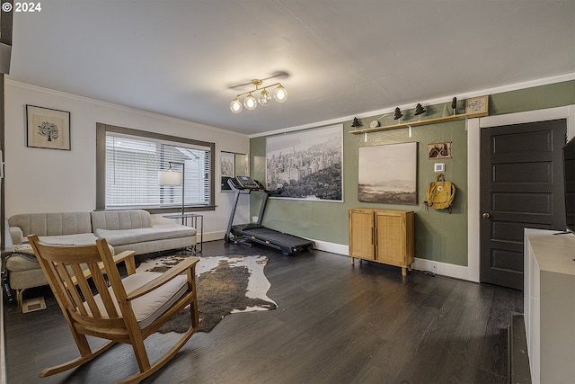 living room featuring dark hardwood / wood-style floors and crown molding