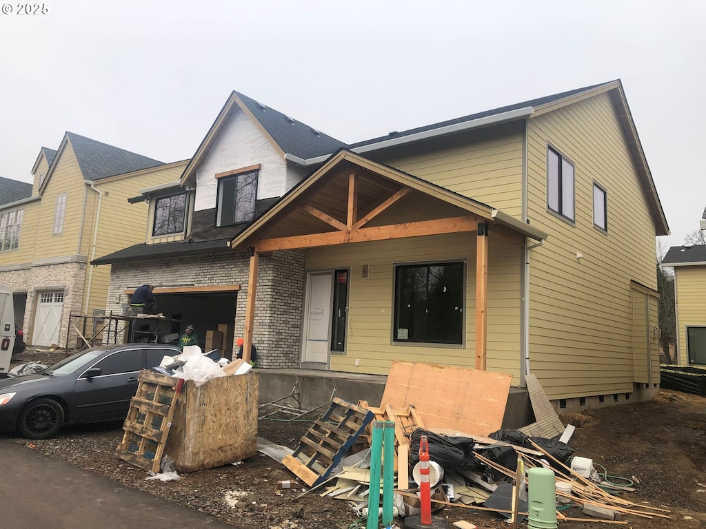 view of front of house with brick siding and an attached garage