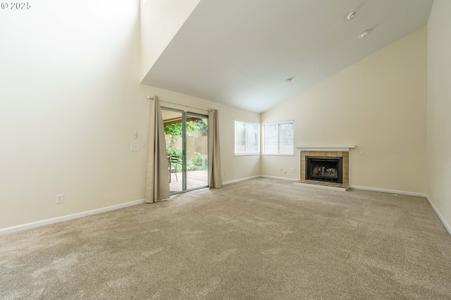 17760 NW Rolling Hill Ln, Beaverton, OR 97006 - unfurnished living room with carpet flooring, high vaulted ceiling, baseboards, and a tiled fireplace