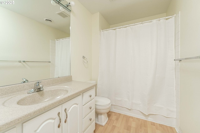 17760 NW Rolling Hill Ln, Beaverton, OR 97006 - full bathroom with toilet, vanity, wood finished floors, and shower / bathtub combination with curtain