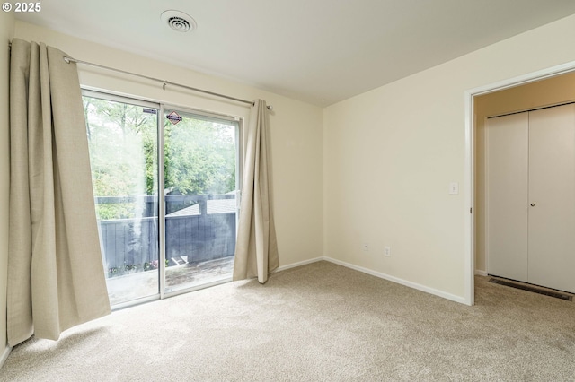 17760 NW Rolling Hill Ln, Beaverton, OR 97006 - unfurnished bedroom with access to exterior, carpet floors, and baseboards