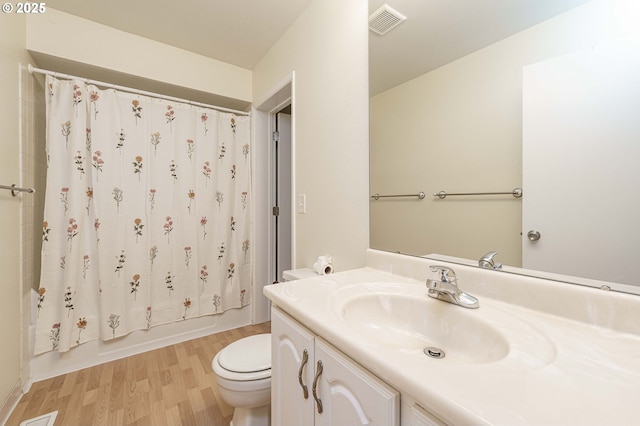 17760 NW Rolling Hill Ln, Beaverton, OR 97006 - bathroom with vanity, wood finished floors, toilet, and shower / tub combo with curtain