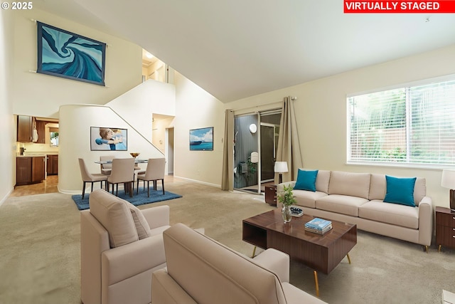 17760 NW Rolling Hill Ln, Beaverton, OR 97006 - living area with light carpet, high vaulted ceiling, and baseboards