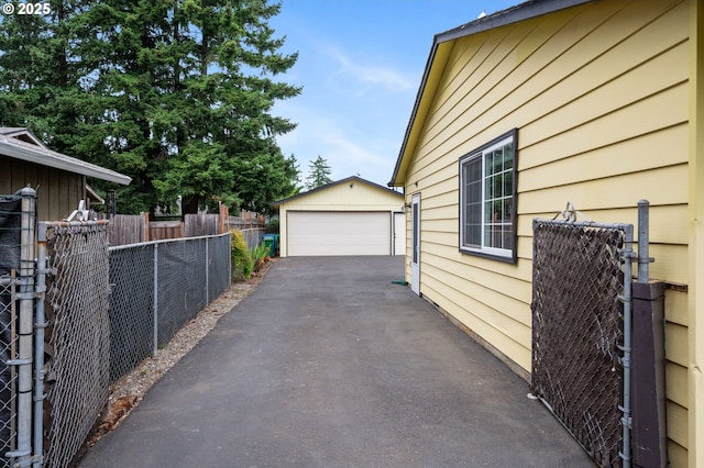 266 NE 193rd Ave, Portland, OR 97230 - view of property exterior featuring an outbuilding and a garage