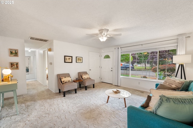 266 NE 193rd Ave, Portland, OR 97230 - living room with a textured ceiling, carpet flooring, and ceiling fan