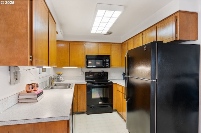 266 NE 193rd Ave, Portland, OR 97230 - kitchen with black appliances, brown cabinets, light countertops, and light floors