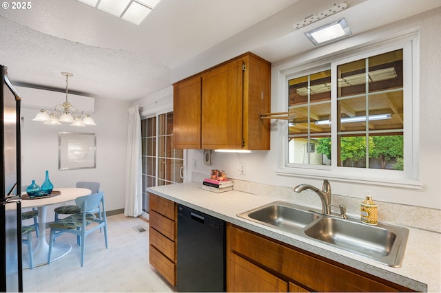 266 NE 193rd Ave, Portland, OR 97230 - kitchen featuring black dishwasher, light countertops, brown cabinetry, hanging light fixtures, and a chandelier