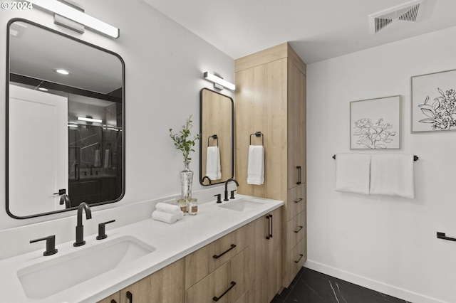 bathroom with tile patterned floors and vanity