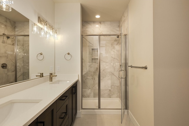 bathroom featuring tile patterned flooring, vanity, and an enclosed shower