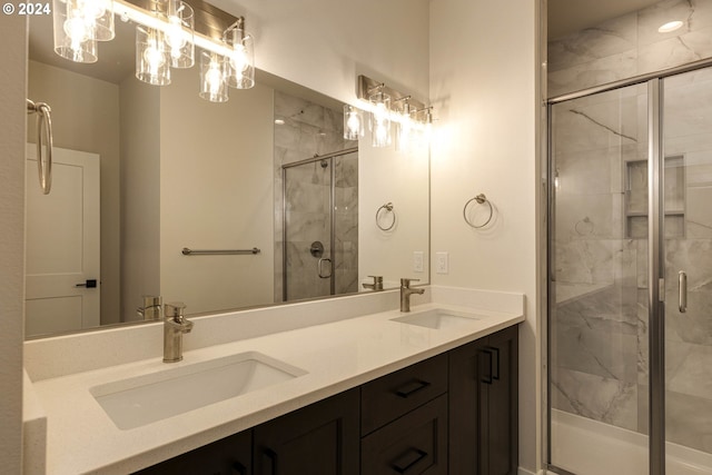 bathroom featuring vanity and a shower with door