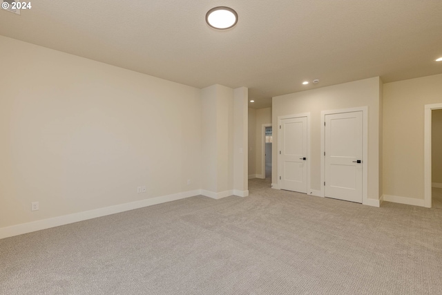 empty room featuring light carpet