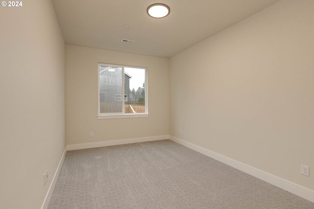 spare room featuring carpet floors