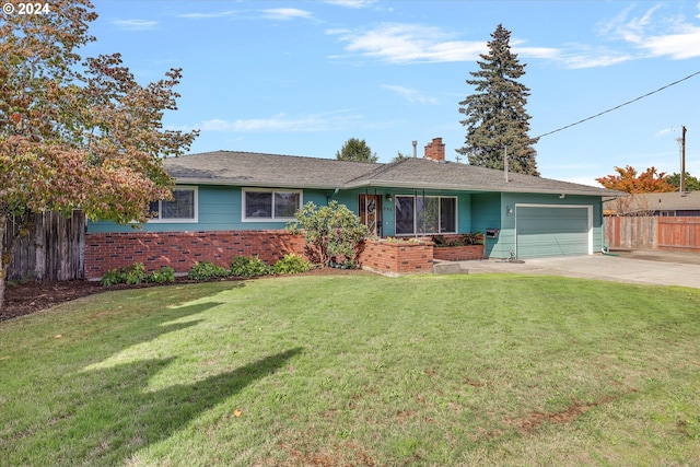 single story home with a garage and a front lawn