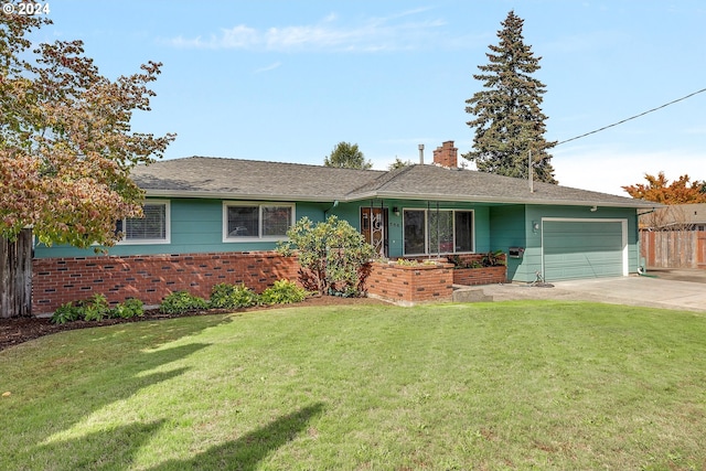 single story home with a front yard and a garage