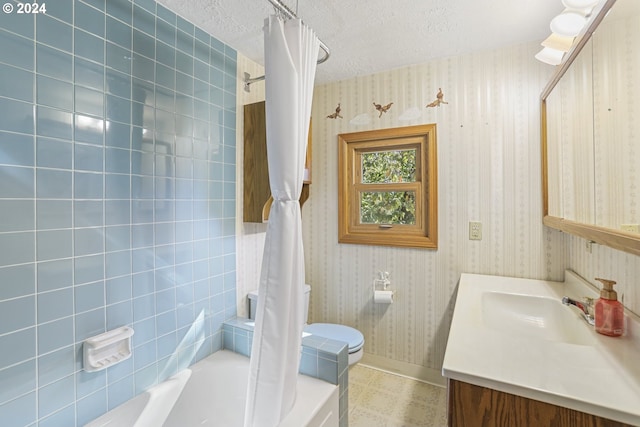 full bathroom featuring vanity, toilet, a textured ceiling, and shower / bath combination with curtain