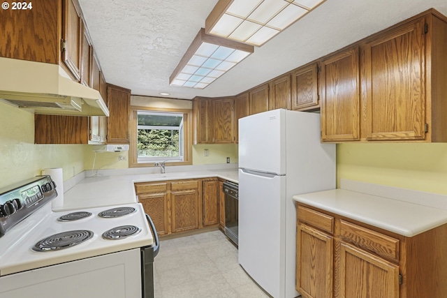 kitchen with white appliances, a textured ceiling, and sink