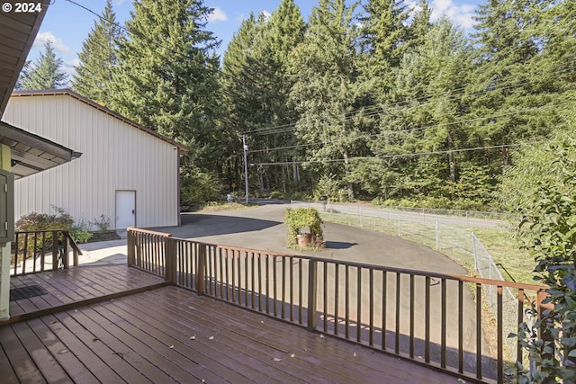 wooden terrace featuring a patio area