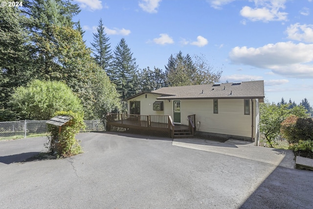 back of property with a wooden deck